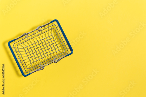 Food basket on a yellow background. Color 2021. Illuminating