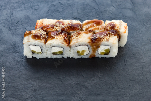 rolls with teriyaki sauce. Rolls and sushi. Avocado, rice, eel. Eel rolls. serving a dish