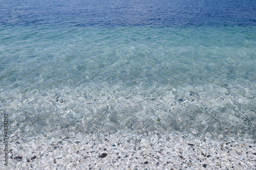 Shells and rocks beneath the clear water near Kanaka Bluff, Portland Island, British Columbia, Canada photo