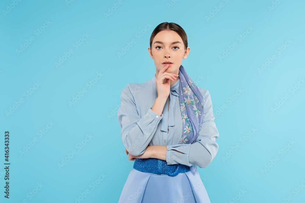 young woman in elegant clothes looking at camera isolated on blue young woman in elegant clothes looking at camera isolated on blue