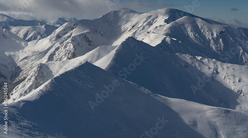 Frozen and snow-capped Tatra peaks © Tomasz
