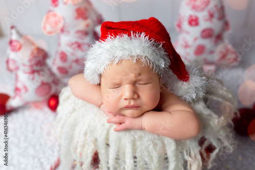 first photo session. newborn child. child in in a New Year's image. first pictures of newborn new year © Svetlana
