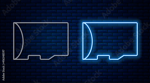 Glowing neon line Micro SD memory card icon isolated on brick wall background. Vector.