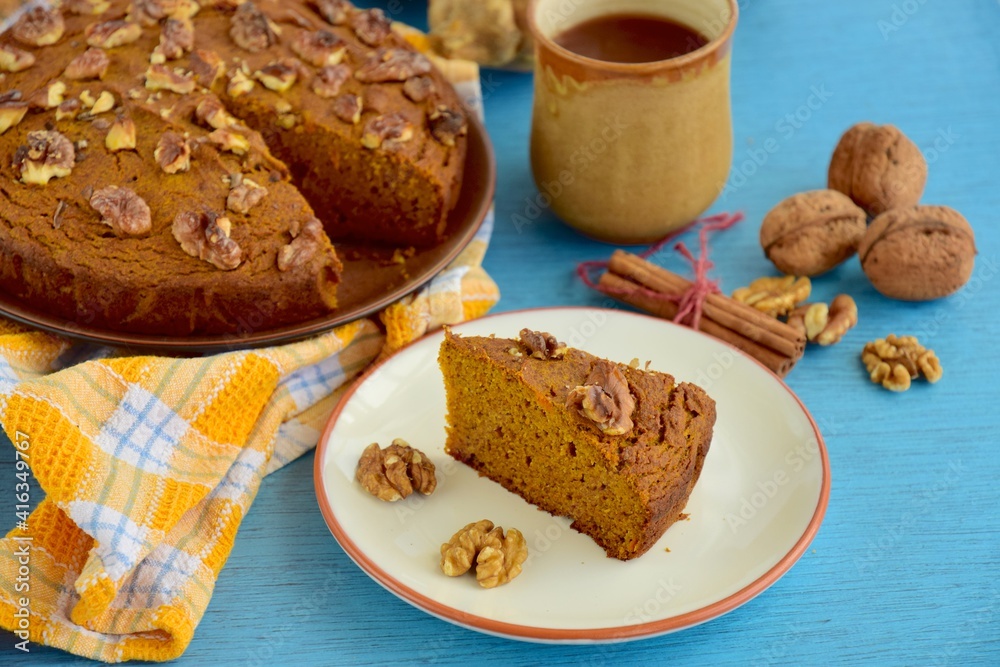 Pumpkin walnut cinnamon chocolate cake served with hot chocolate drink Pumpkin walnut cinnamon chocolate cake served with hot chocolate drink