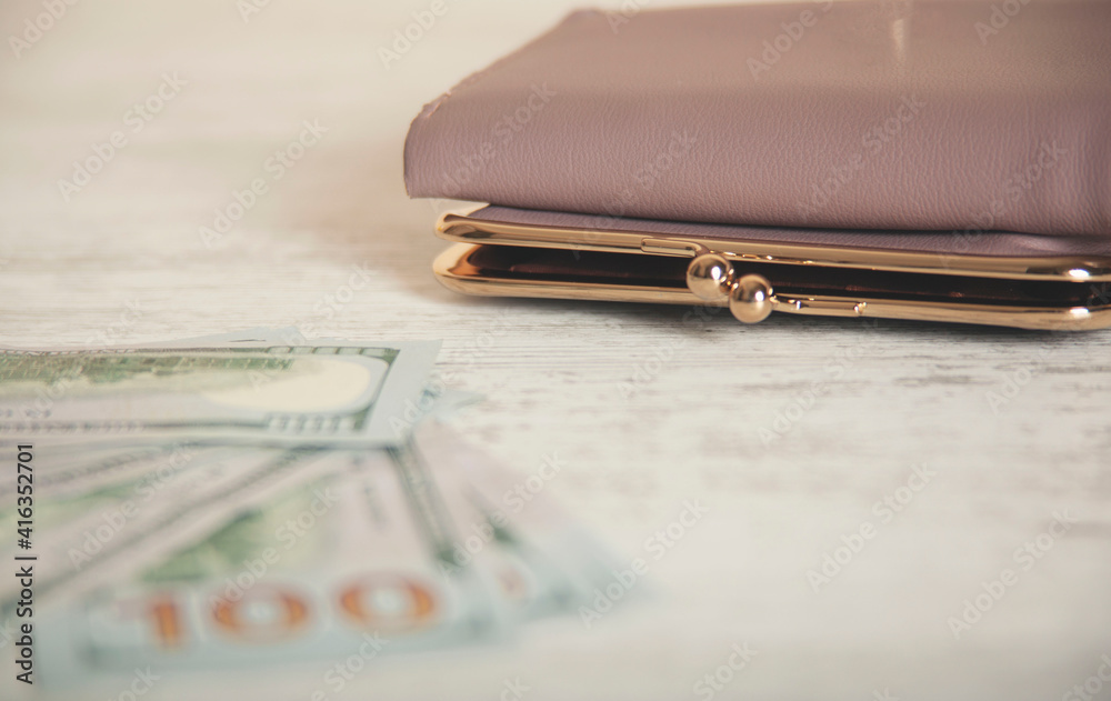 wallet with money on desk