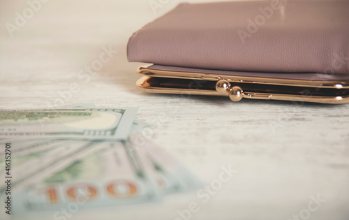 wallet with money on desk