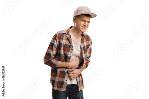 Teenage guy suffering from stomach pain