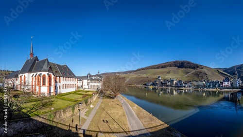 skyline of Bernkastel-Kues with river Mosel and Cusanus Stift photo