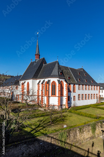 skyline of Bernkastel-Kues with river Mosel and Cusanus Stift photo