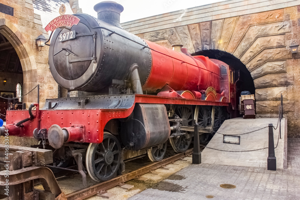 Fototapeta premium The Hogwarts Express in the wizarding world of Harry Potter at Universal Studios Orlando Island of Adventure. theme park in Orlando