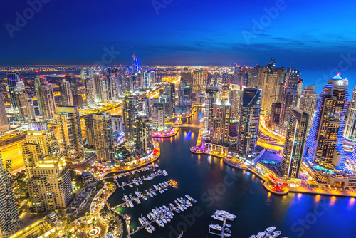 City and Marina Dock at blue hour with cloudy sky
