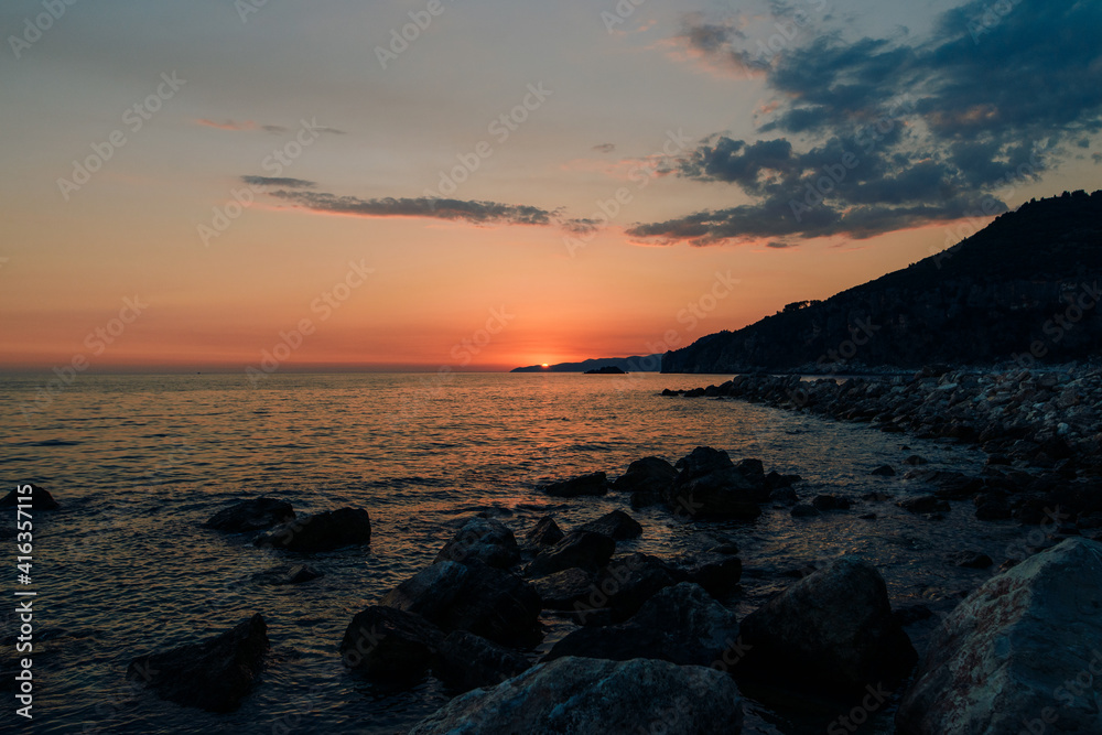 Beautiful orange sunset at the Adriatic sea in Montenegro 