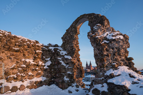 Stone ruins of an ancient medieval Rezekne castle in Latgale, Latvia. Arch on background of blue sky. Catholic Church. photo