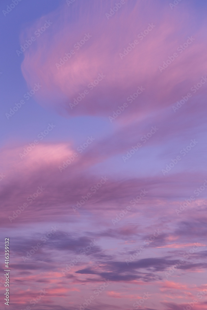 Dramatic sunrise, sunset pink violet blue sky with clouds abstract background texture