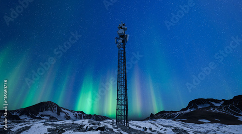 Fotografia Telecommunication tower with 5G cellular network antenna on night winter landsca
