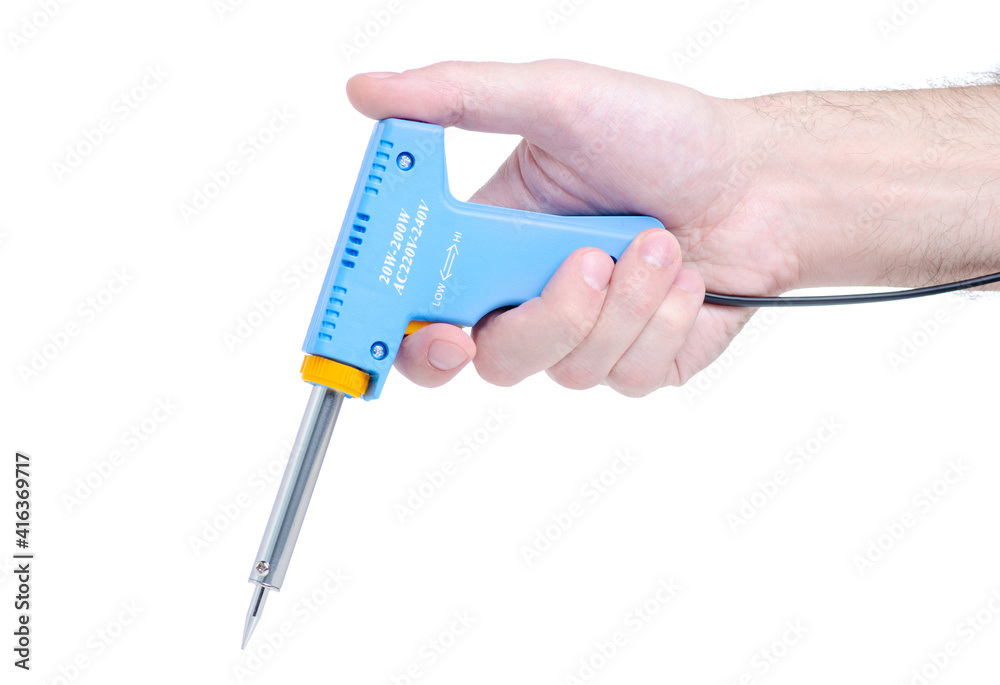 Soldering iron gun in hand on white background isolation Soldering iron gun in hand on white background isolation