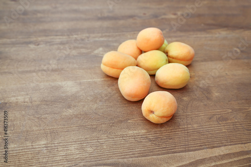 juicy apricot on a wooden table