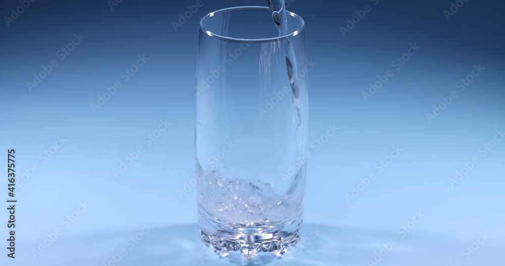 Super slow motion of pouring water into a glass Super slow motion of pouring water into a glass