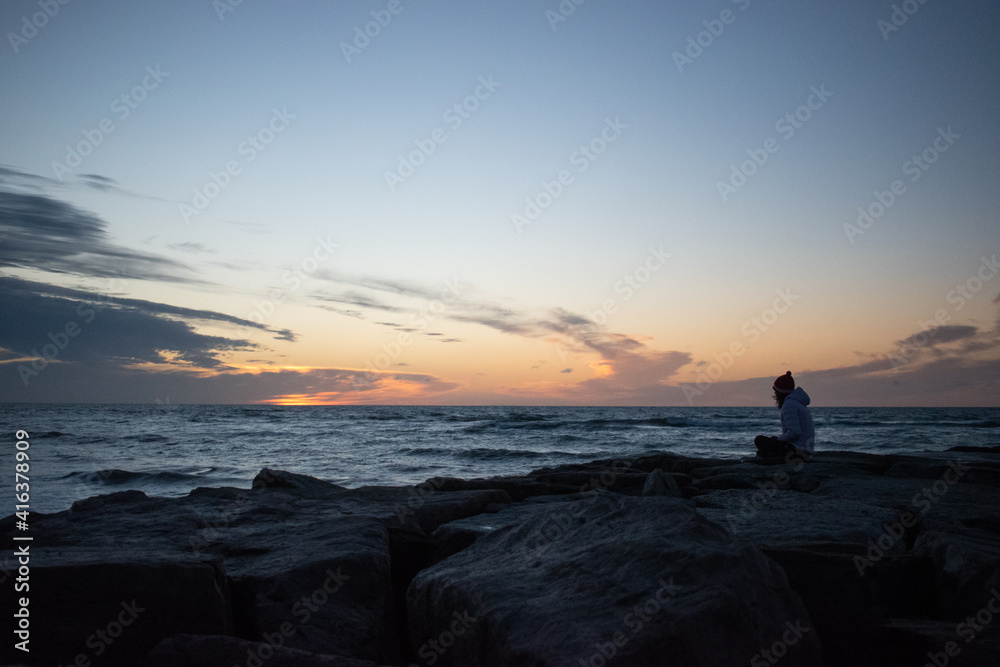 person on the beach in a sunrise