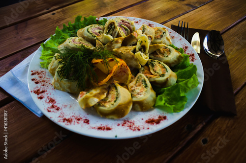 tender fried pancake stuffed with mushroom meat and herbs with sauce