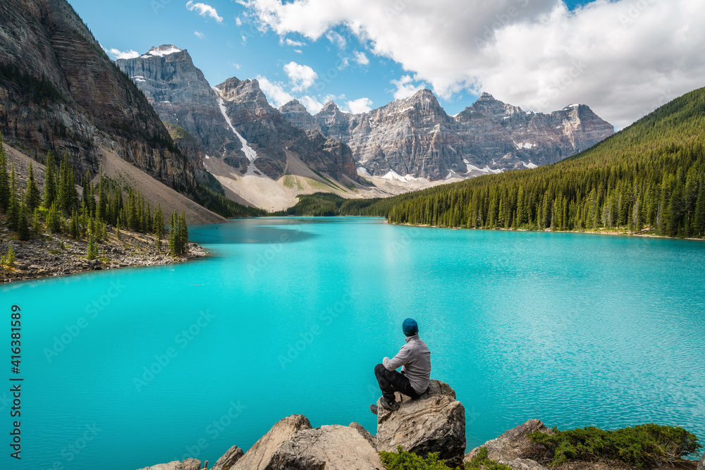 Hiker at Moraine Lake during summer in Banff National Park, Alberta, Canada.