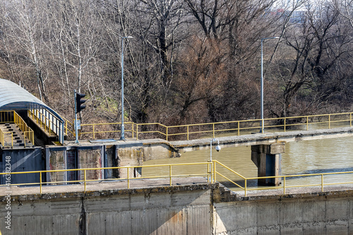 Fragment of the river lock system - closing gates, semaphore and pier