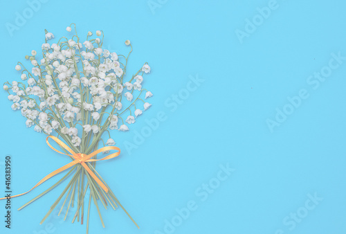 bouquet of white flowers on a blue background. 