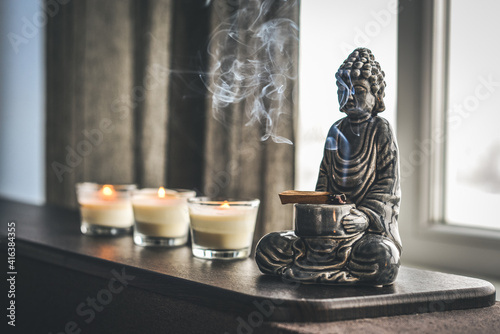 Candlestick in the shape of a buddha