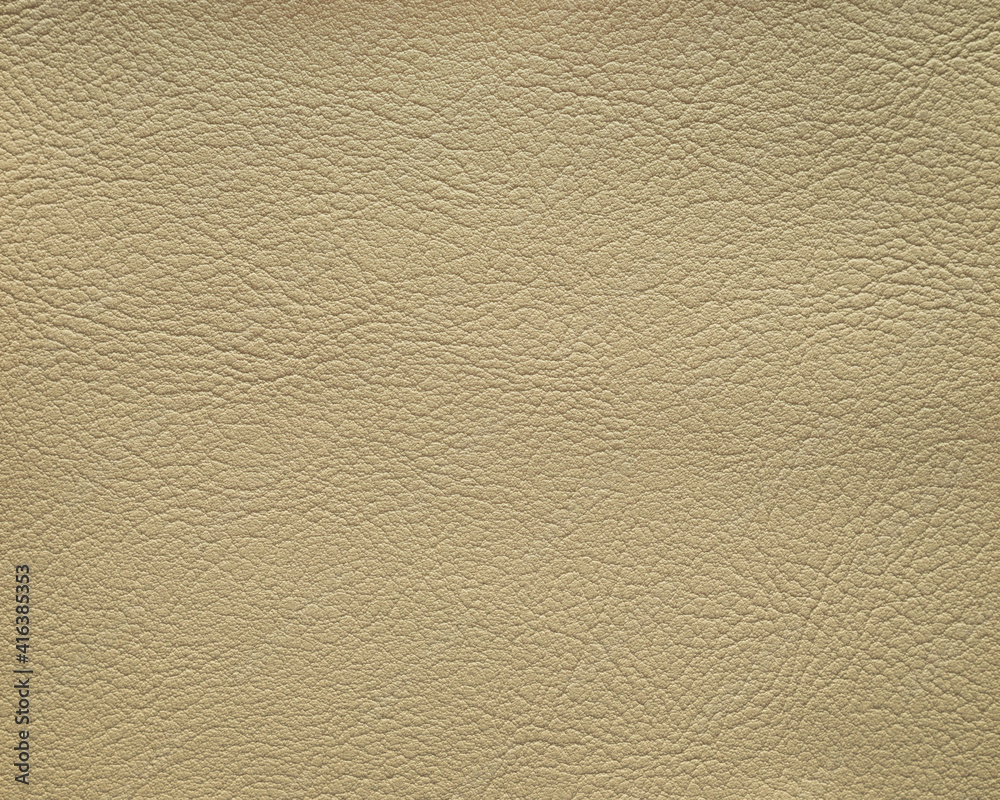 The leather texture pale brown in color, background. The leather texture pale brown in color, background.