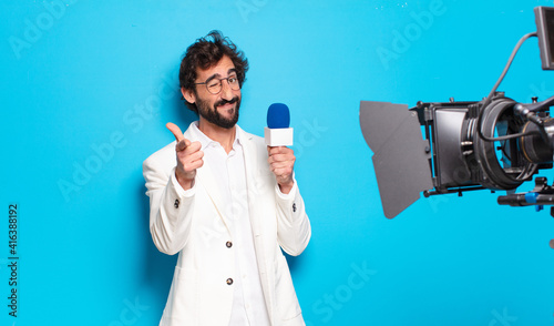Картината върху платно young bearded man television presenter.