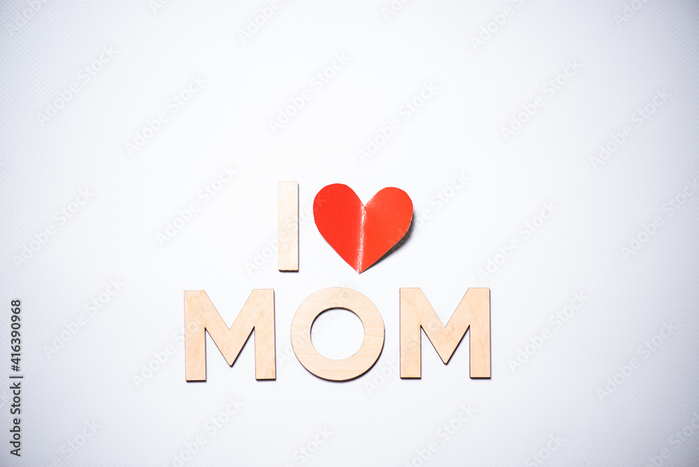 Wooden letters on a background. Congratulations with mothers day Wooden letters on a background. Congratulations with mothers day