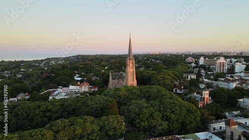 Aerial shot orbiting around San Isidro Cathedral in Buenos Aires at sunset photo