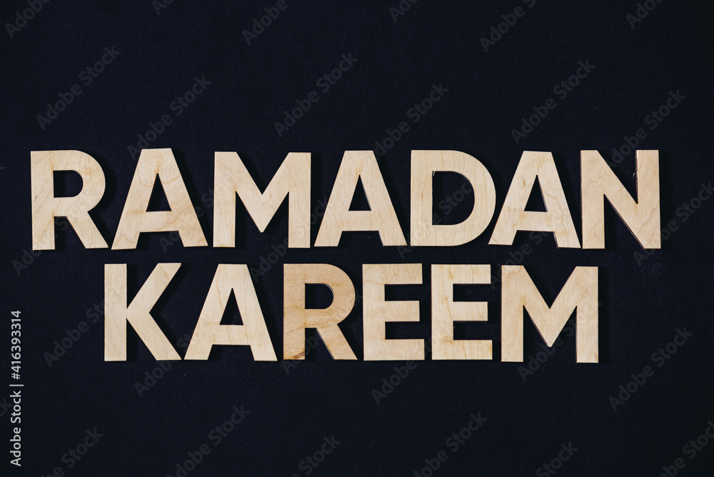 Ramadan. Wooden letter on  background