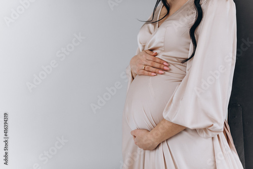 Portrait of the young pregnant woman