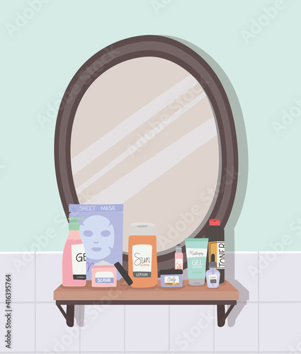 mirror and set of skincare icons on a shelf inside of a bathroom
