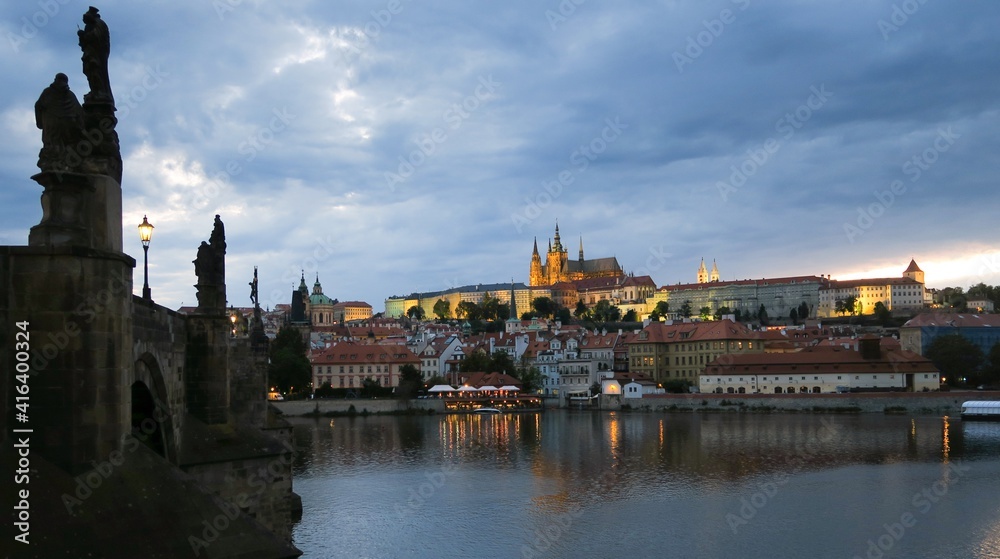 evening view of Prague Castle with the Vltava River from Charles Bridge in Prague Czech Republic