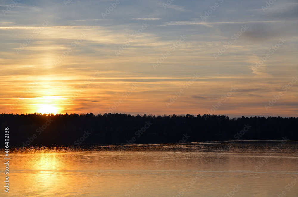 Orange sunset over the lake. Selective focus.