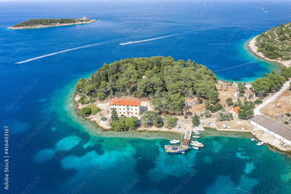Aerial drone shot of small peninsula on Vis Island in Adriatic sea in Croatia summer