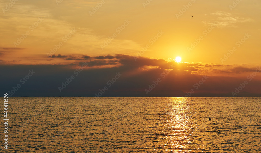 Fototapeta premium Amazing Sunset on the Sea. Adriatic sea, beautiful sunset, waves and landscape. Lignano Sabbiadoro, Italy.