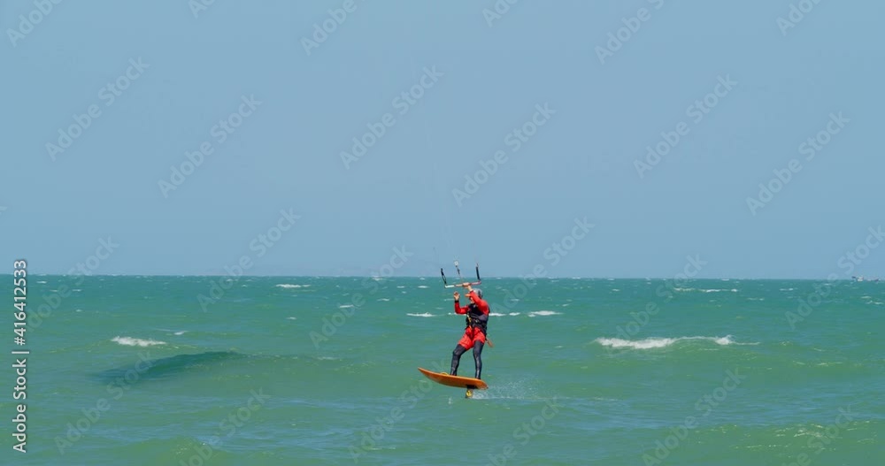 Aerial view of the city beach and active people practicing kite surfing and windsurfing. Kitesurfing place, sports concept, healthy lifestyle, human flight. Aerial view of the city beach and active people practicing kite surfing and windsurfing. Kitesurfing place, sports concept, healthy lifestyle, human flight.