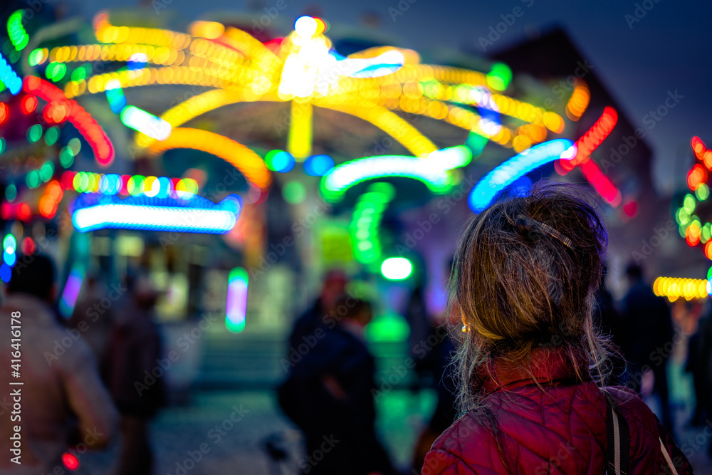 Fairground with carousel and colorful lights