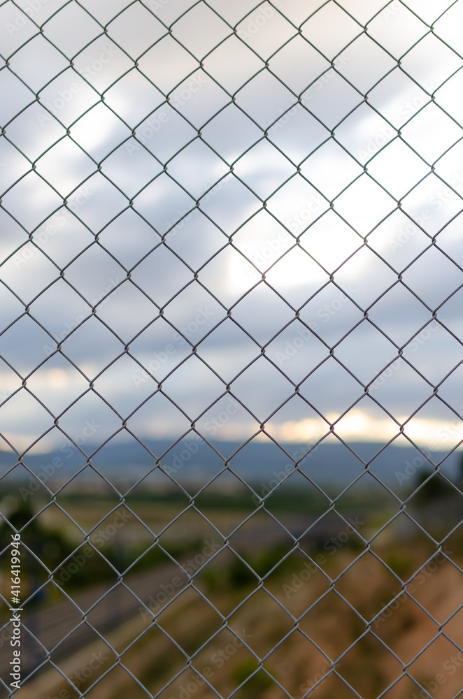 Fence with train tracks in the background Fence with train tracks in the background