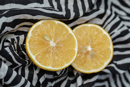Fresh yellow sliced lemons on beautiful tablecloth