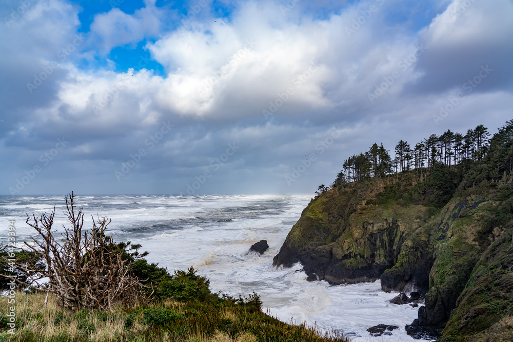 A headland dropping into the Pacific Oceannear the mouth of the Columbia River, Ilwaco, Washington.