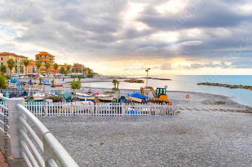 Morning sunlight along the Mediterranean Sea at the coastal resort town of Ventimiglia, Italy, on the Italian Riviera. photo