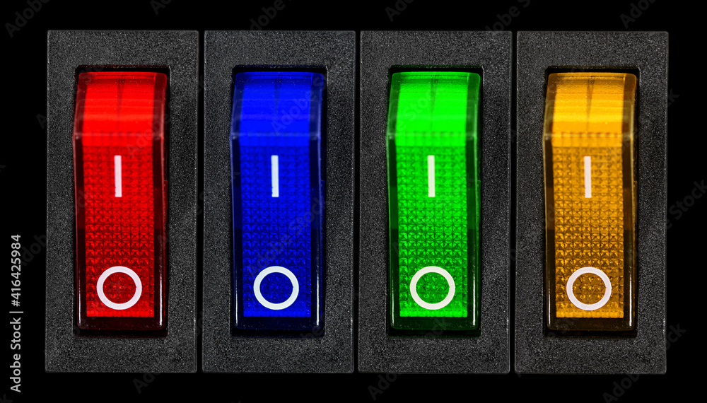 Red, blue, green and yellow power switches at OF position, isolated on black background