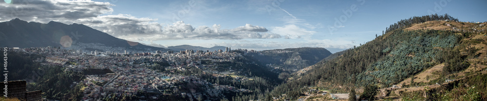 Panoramic of the city of Quito, Ecuador with view towards the city, the mountains and the streams