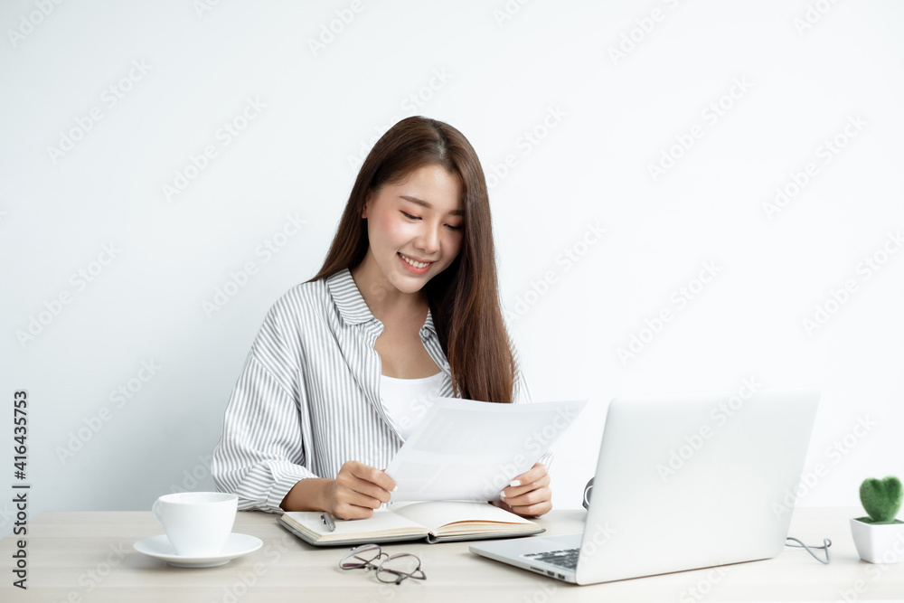 Video Call Asian women communicate via online video remotely from a digital laptop, say hello to colleagues, discuss projects, work, business, finance Video Call Asian women communicate via online video remotely from a digital laptop, say hello to colleagues, discuss projects, work, business, finance