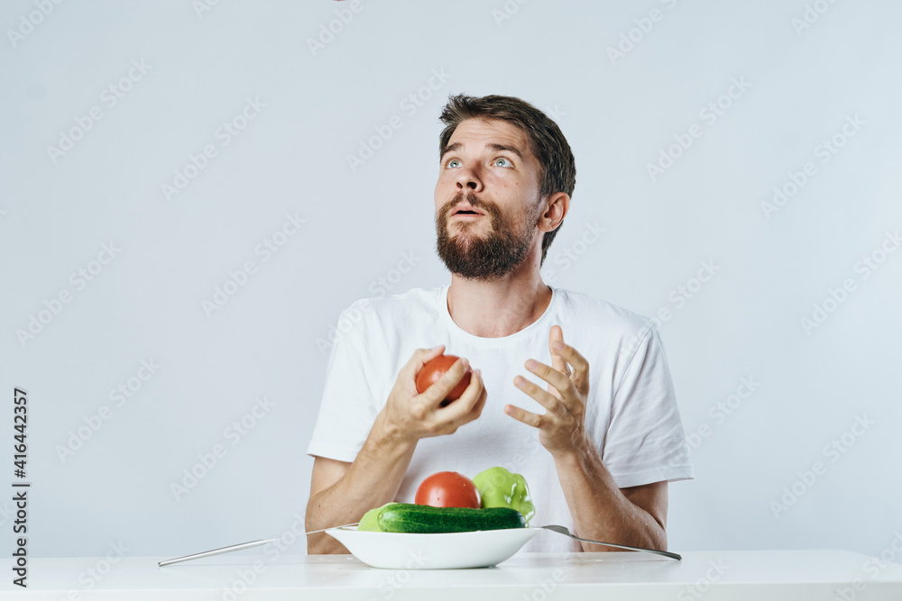 Bearded man in white t-shirt vegetables diet health vegetarian Bearded man in white t-shirt vegetables diet health vegetarian