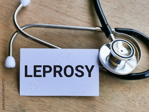 Phrase LEPROSY written on white card with stethoscope. Medical and health concept. photo